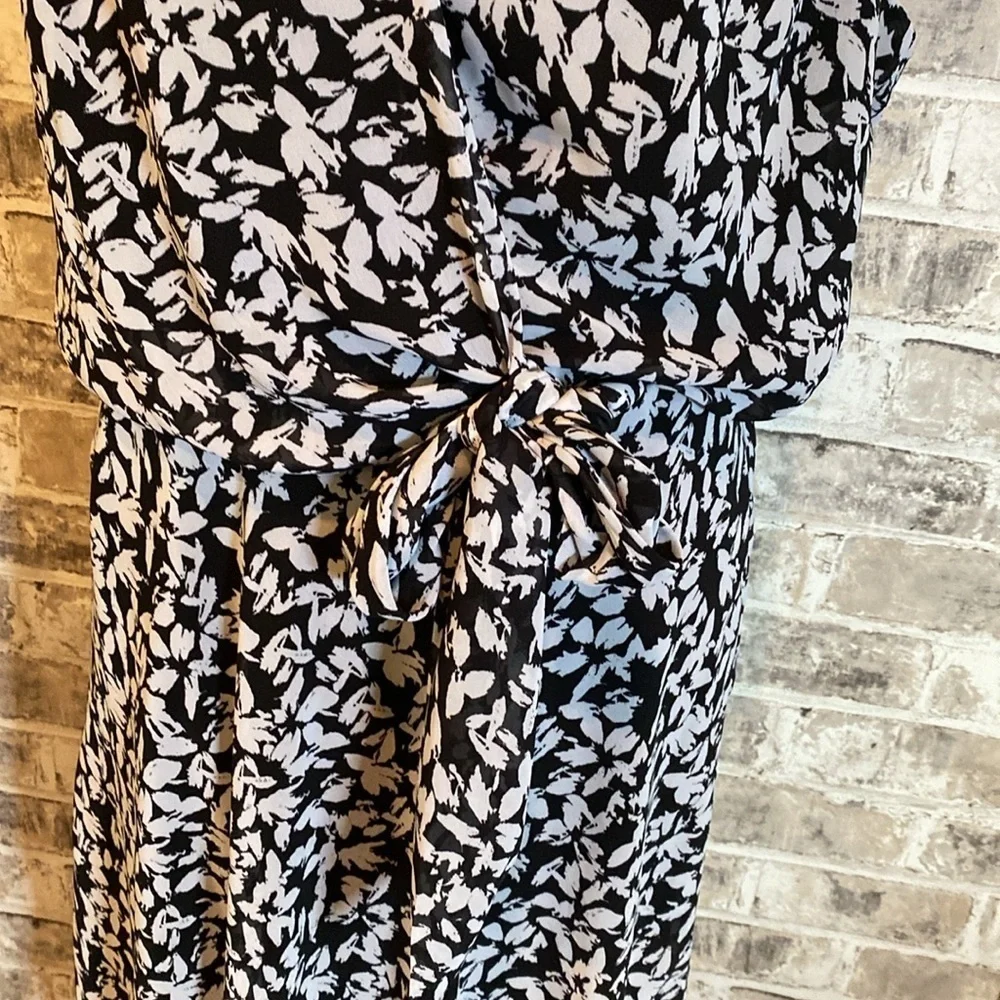 Karin Steven’s sleeveless black/white patterned lined dress. Tie at neck & waist